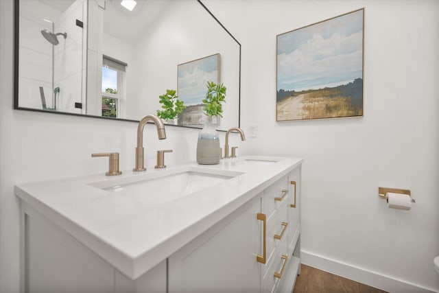 3302 Mckamy Oaks Trl, Arlington, TX 76017 - full bathroom with double vanity, wood finished floors, and a shower