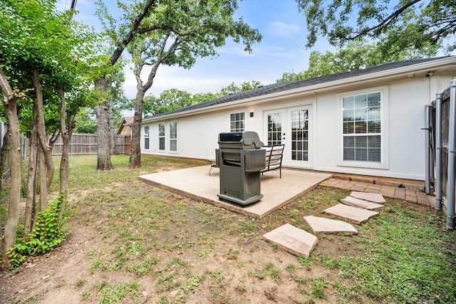 3302 Mckamy Oaks Trl, Arlington, TX 76017 - back of house with french doors and a patio area
