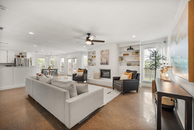 3302 Mckamy Oaks Trl, Arlington, TX 76017 - living area featuring recessed lighting, a ceiling fan, a large fireplace, and built in shelves