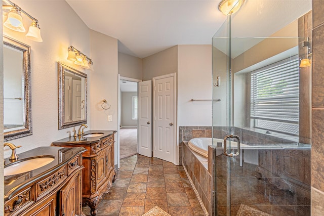 1900 Sumac Dr, Flower Mound, TX 75028 - full bath featuring two vanities, a garden tub, a shower stall, and stone finish floors