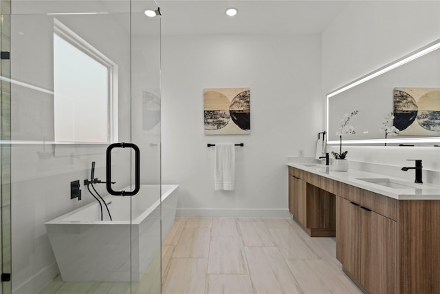 404 Cleaves St, Dallas, TX 75203 - bathroom featuring double vanity, a soaking tub, and recessed lighting