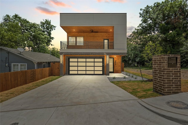 404 Cleaves St, Dallas, TX 75203 - contemporary house featuring a balcony, driveway, and an attached garage