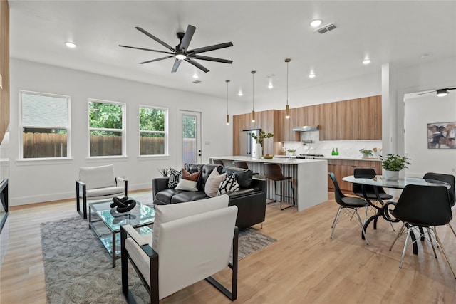 404 Cleaves St, Dallas, TX 75203 - living room with light wood-style flooring, ceiling fan, and recessed lighting