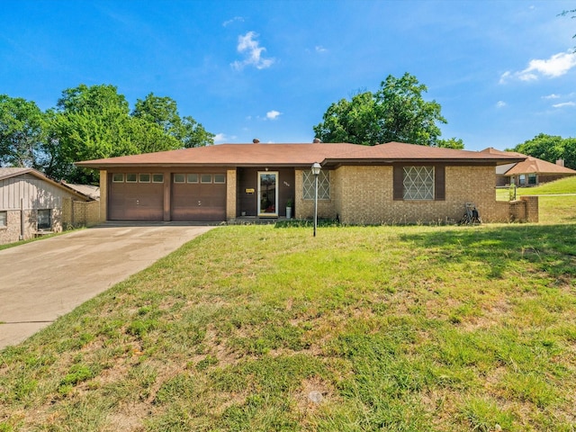 6500 Chapel Ln, Lake Worth, TX 76135 - ranch-style house with a garage, driveway, a front yard, and brick siding
