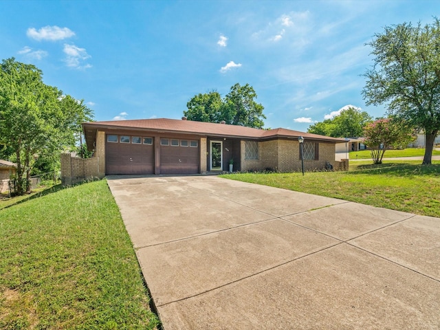 6500 Chapel Ln, Lake Worth, TX 76135 - view of front of house with an attached garage, concrete driveway, a front yard, and brick siding