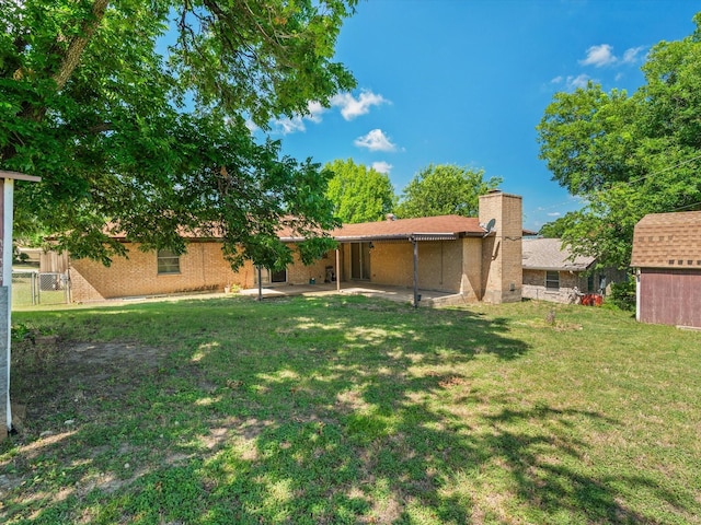 6500 Chapel Ln, Lake Worth, TX 76135 - view of yard featuring a patio area and a storage unit