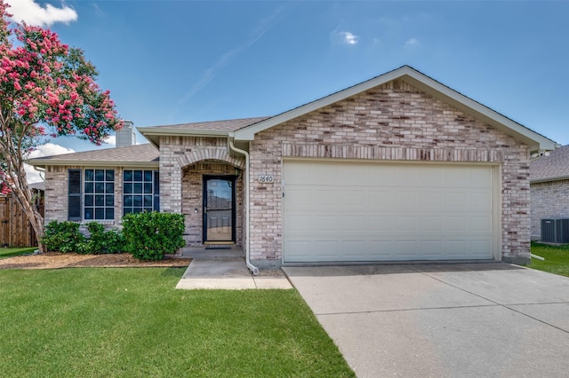 1640 Fieldstone Dr, Little Elm, TX 75068 - ranch-style home with concrete driveway, brick siding, a shingled roof, and a front lawn