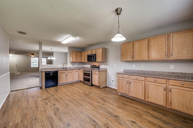 1640 Fieldstone Dr, Little Elm, TX 75068 - kitchen featuring black appliances, light wood-type flooring, a textured ceiling, pendant lighting, and ceiling fan