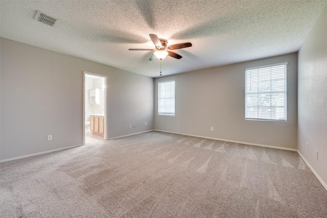 1640 Fieldstone Dr, Little Elm, TX 75068 - empty room featuring a ceiling fan, light carpet, and a textured ceiling