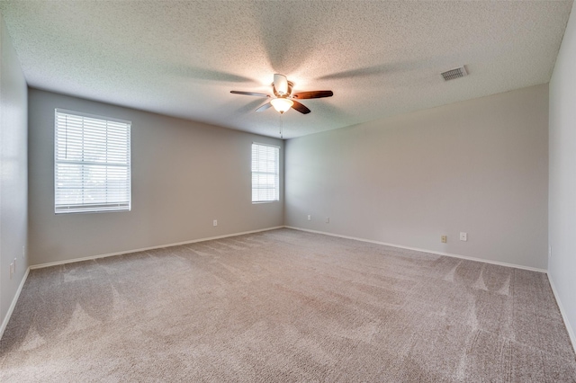 1640 Fieldstone Dr, Little Elm, TX 75068 - spare room featuring a ceiling fan, carpet, and a textured ceiling