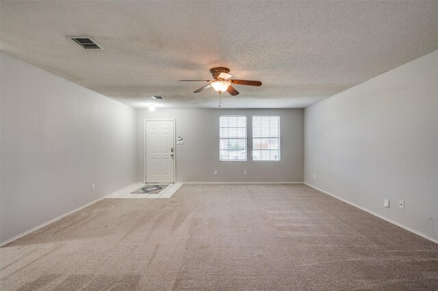 1640 Fieldstone Dr, Little Elm, TX 75068 - unfurnished room with ceiling fan, light colored carpet, and a textured ceiling