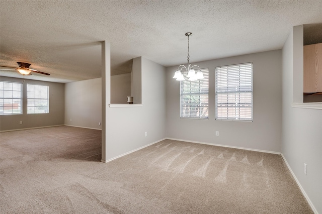1640 Fieldstone Dr, Little Elm, TX 75068 - spare room featuring light carpet, a textured ceiling, a chandelier, and ceiling fan