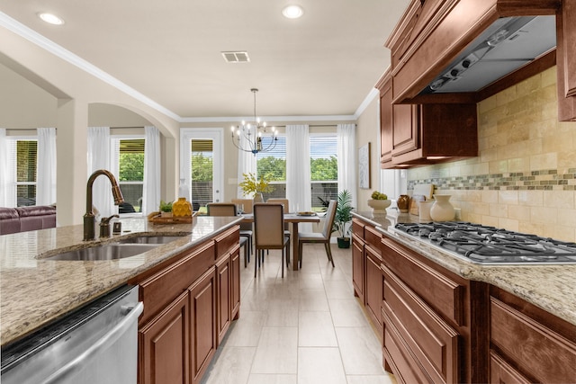 10014 Edgeway Cir, Rowlett, TX 75089 - kitchen featuring appliances with stainless steel finishes, exhaust hood, light stone counters, healthy amount of natural light, and crown molding
