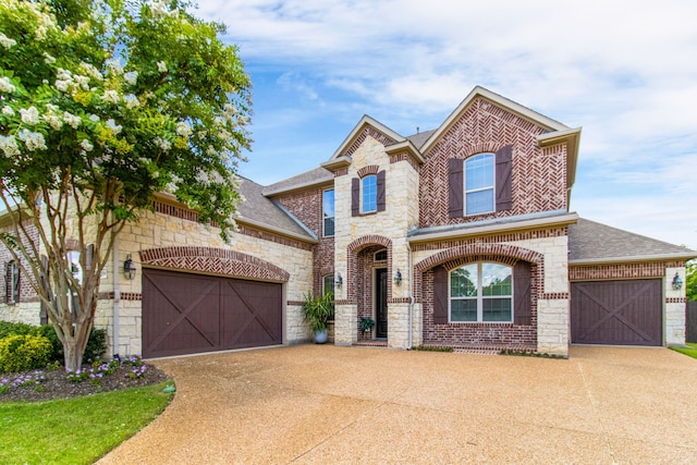 10014 Edgeway Cir, Rowlett, TX 75089 - french country style house featuring concrete driveway, roof with shingles, an attached garage, and brick siding
