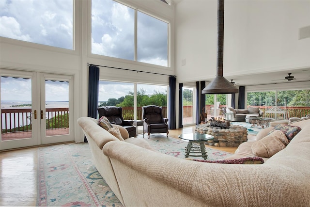 214 Island View Dr, Pottsboro, TX 75076 - living room featuring a towering ceiling, wood finished floors, and french doors