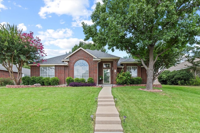 4315 Sarasota Ln, Mckinney, TX 75070 - view of front of home featuring a front lawn, brick siding, and a shingled roof