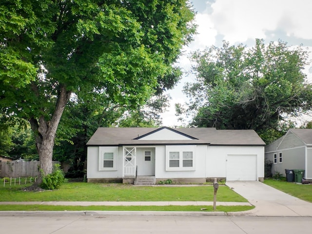 904 Forrestal Dr, Arlington, TX 76010 - view of front of home featuring a garage, concrete driveway, and stucco siding