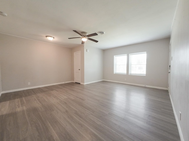 904 Forrestal Dr, Arlington, TX 76010 - unfurnished room featuring a ceiling fan and wood finished floors