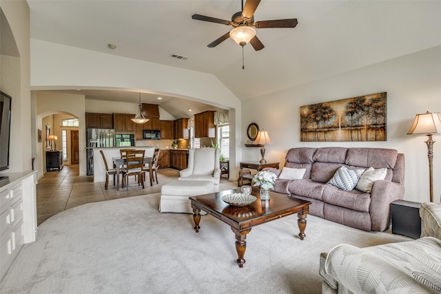 2821 Nighthawk Dr, Mesquite, TX 75181 - living room with arched walkways, lofted ceiling, ceiling fan, and light tile patterned flooring