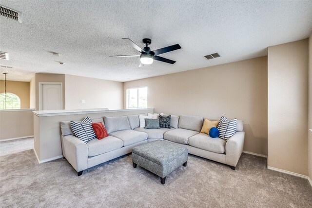 2701 Timberhill Dr, Flower Mound, TX 75028 - carpeted living area with ceiling fan and a textured ceiling