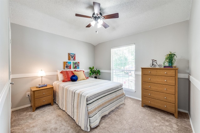 2701 Timberhill Dr, Flower Mound, TX 75028 - bedroom featuring light carpet, a textured ceiling, and ceiling fan