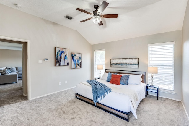 2701 Timberhill Dr, Flower Mound, TX 75028 - carpeted bedroom with lofted ceiling, multiple windows, and a ceiling fan