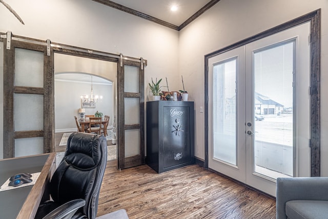 3240 Glenmore Ave, Northlake, TX 76247 - home office featuring a barn door, ornamental molding, french doors, wood finished floors, and plenty of natural light