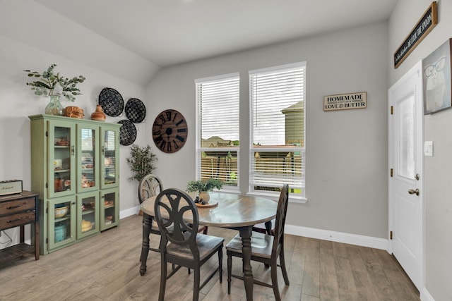 621 Mesquite Grove Rd, Midlothian, TX 76065 - dining room with light wood-type flooring, healthy amount of natural light, and lofted ceiling