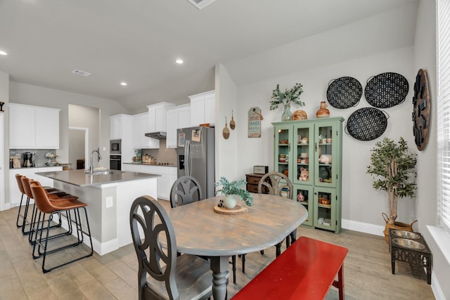 621 Mesquite Grove Rd, Midlothian, TX 76065 - dining area featuring light wood finished floors, recessed lighting, and lofted ceiling