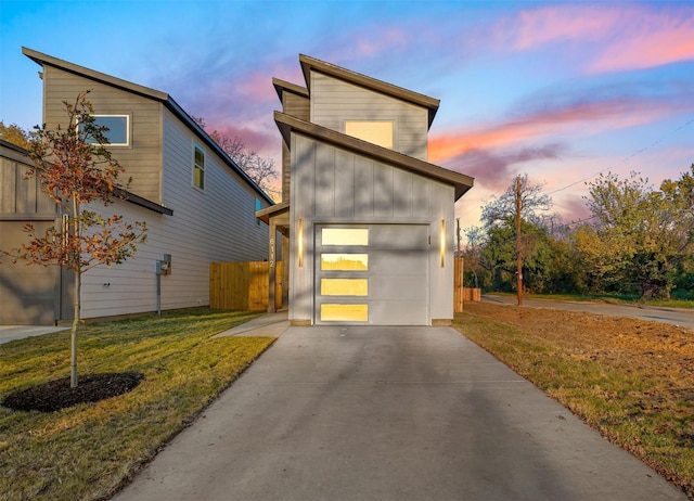 6112 Carlton Garret St, Dallas, TX 75215 - view of front of home featuring driveway, a garage, and board and batten siding