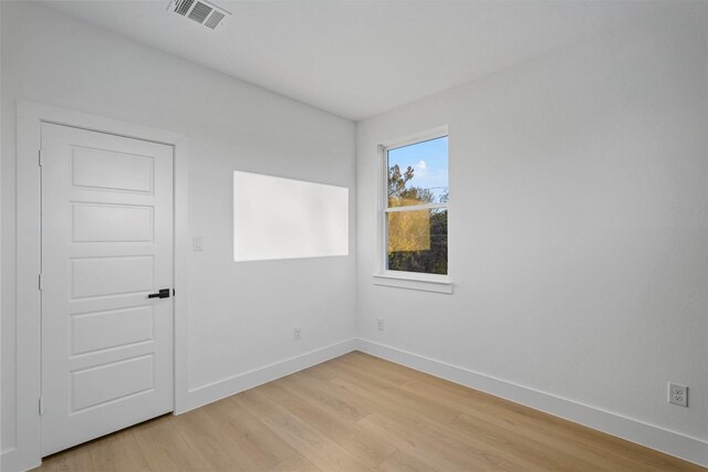 6112 Carlton Garret St, Dallas, TX 75215 - empty room with light wood finished floors and baseboards