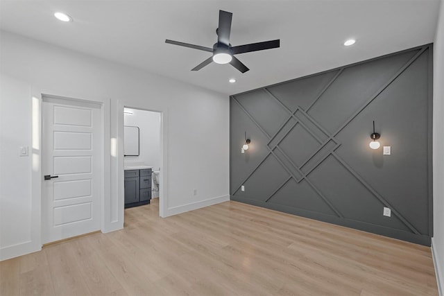 6112 Carlton Garret St, Dallas, TX 75215 - unfurnished bedroom featuring light wood-style flooring, recessed lighting, a decorative wall, ensuite bath, and a ceiling fan