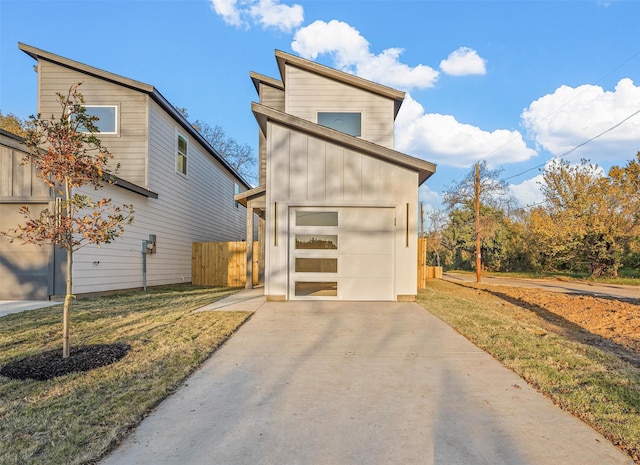 6112 Carlton Garret St, Dallas, TX 75215 - contemporary home with concrete driveway, a garage, and board and batten siding