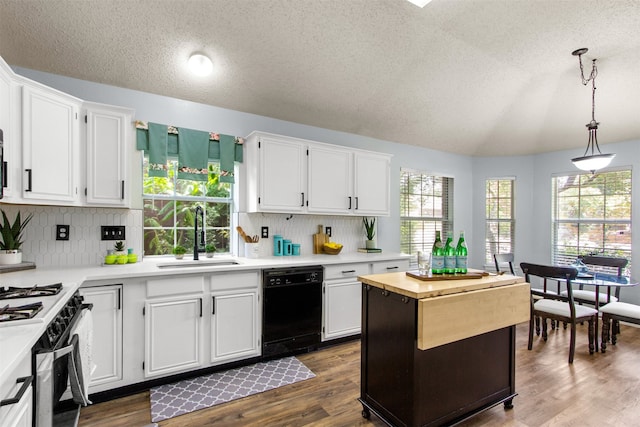2073 Rushmore Ct, Lewisville, TX 75067 - kitchen with dishwasher, a textured ceiling, white cabinetry, vaulted ceiling, and white range with gas stovetop