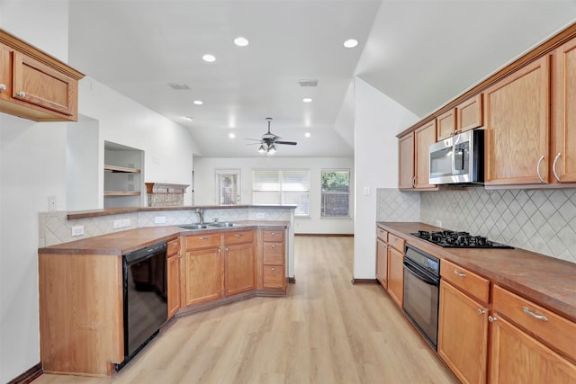 1629 Lakeside Dr, Allen, TX 75002 - kitchen featuring black appliances, light wood-type flooring, ceiling fan, recessed lighting, and backsplash