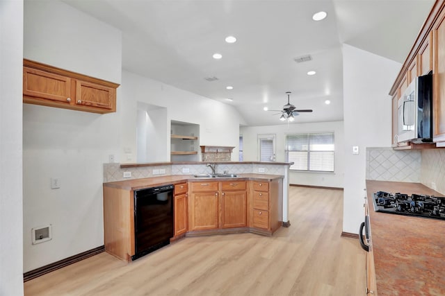 1629 Lakeside Dr, Allen, TX 75002 - kitchen with black appliances, a peninsula, light wood-style flooring, backsplash, and brown cabinetry