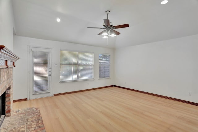 1629 Lakeside Dr, Allen, TX 75002 - unfurnished living room with a brick fireplace, ceiling fan, wood finished floors, and recessed lighting