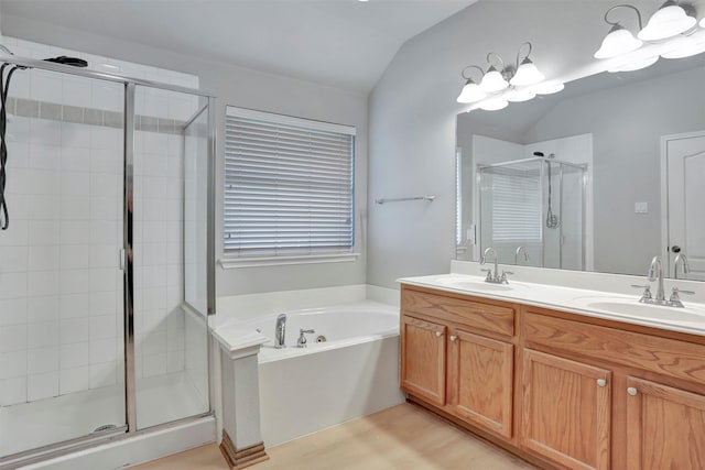 1629 Lakeside Dr, Allen, TX 75002 - full bath with a shower stall, vaulted ceiling, a bath, double vanity, and wood finished floors