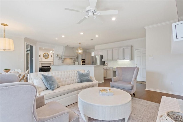 10003 Willow Bend Dr, Woodway, TX 76712 - living area with recessed lighting, wood finished floors, a ceiling fan, and crown molding