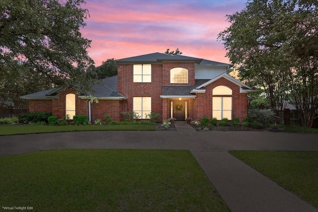 10003 Willow Bend Dr, Woodway, TX 76712 - traditional-style house with a front yard and brick siding