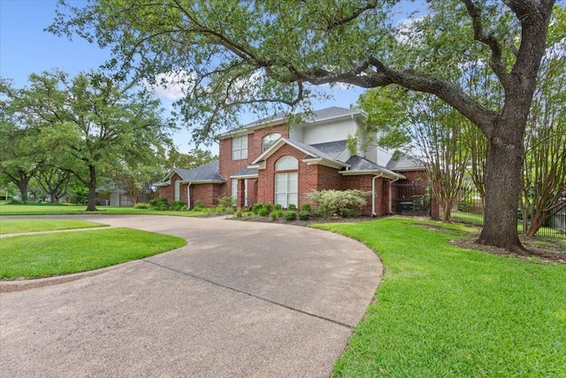 10003 Willow Bend Dr, Woodway, TX 76712 - traditional-style home with brick siding and curved driveway