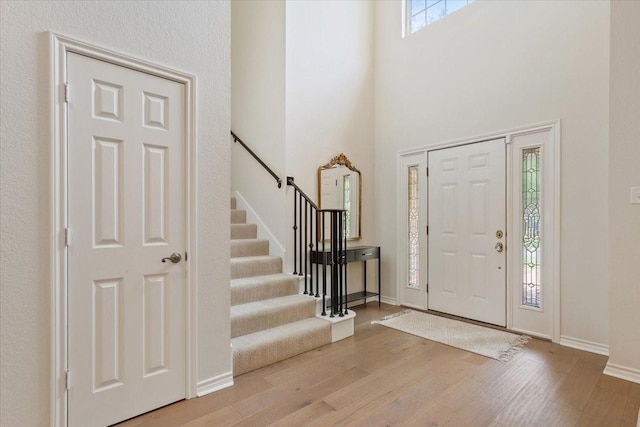 10003 Willow Bend Dr, Woodway, TX 76712 - entryway with wood finished floors, stairs, and a high ceiling