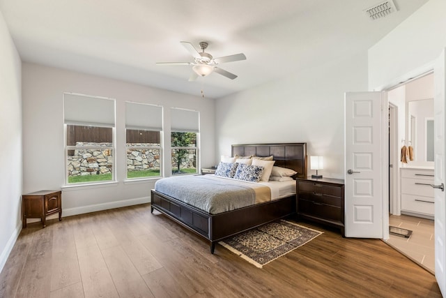 313 Savannah Ln, Oak Point, TX 75068 - bedroom with wood finished floors, a ceiling fan, and ensuite bath