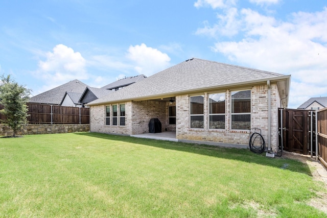 313 Savannah Ln, Oak Point, TX 75068 - rear view of house featuring brick siding, a fenced backyard, and roof with shingles
