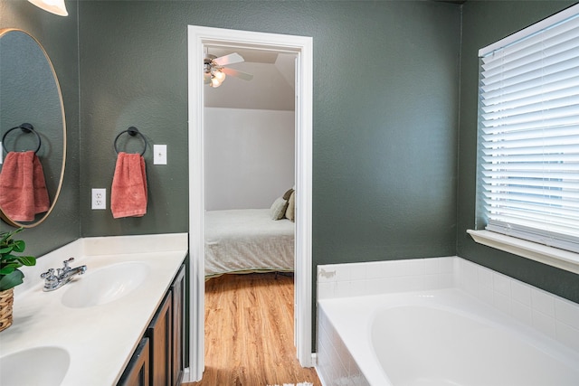 9028 Wild Rose Ln, Cross Roads, TX 76227 - ensuite bathroom with double vanity, a bath, ceiling fan, and wood finished floors