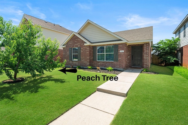9028 Wild Rose Ln, Cross Roads, TX 76227 - view of front of property featuring a front yard and brick siding