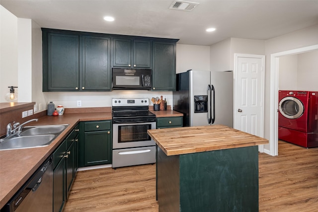 9028 Wild Rose Ln, Cross Roads, TX 76227 - kitchen featuring stainless steel appliances, washer / dryer, light wood-type flooring, butcher block counters, and recessed lighting