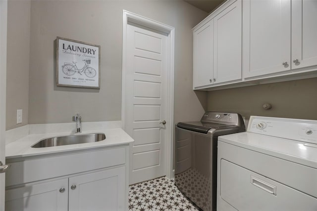 4857 Cumberland Cir, Carrollton, TX 75010 - washroom featuring cabinet space, washing machine and dryer, and light flooring