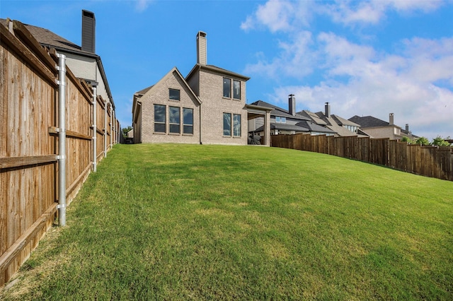 4857 Cumberland Cir, Carrollton, TX 75010 - back of house featuring a fenced backyard and a chimney