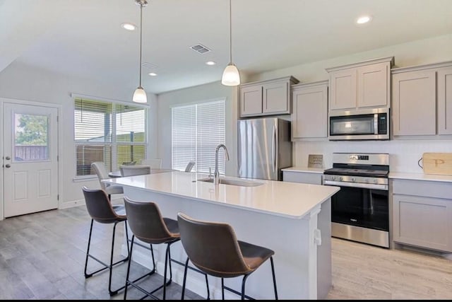 532 Dunmore Dr, Fort Worth, TX 76052 - kitchen with appliances with stainless steel finishes, gray cabinetry, light countertops, and recessed lighting
